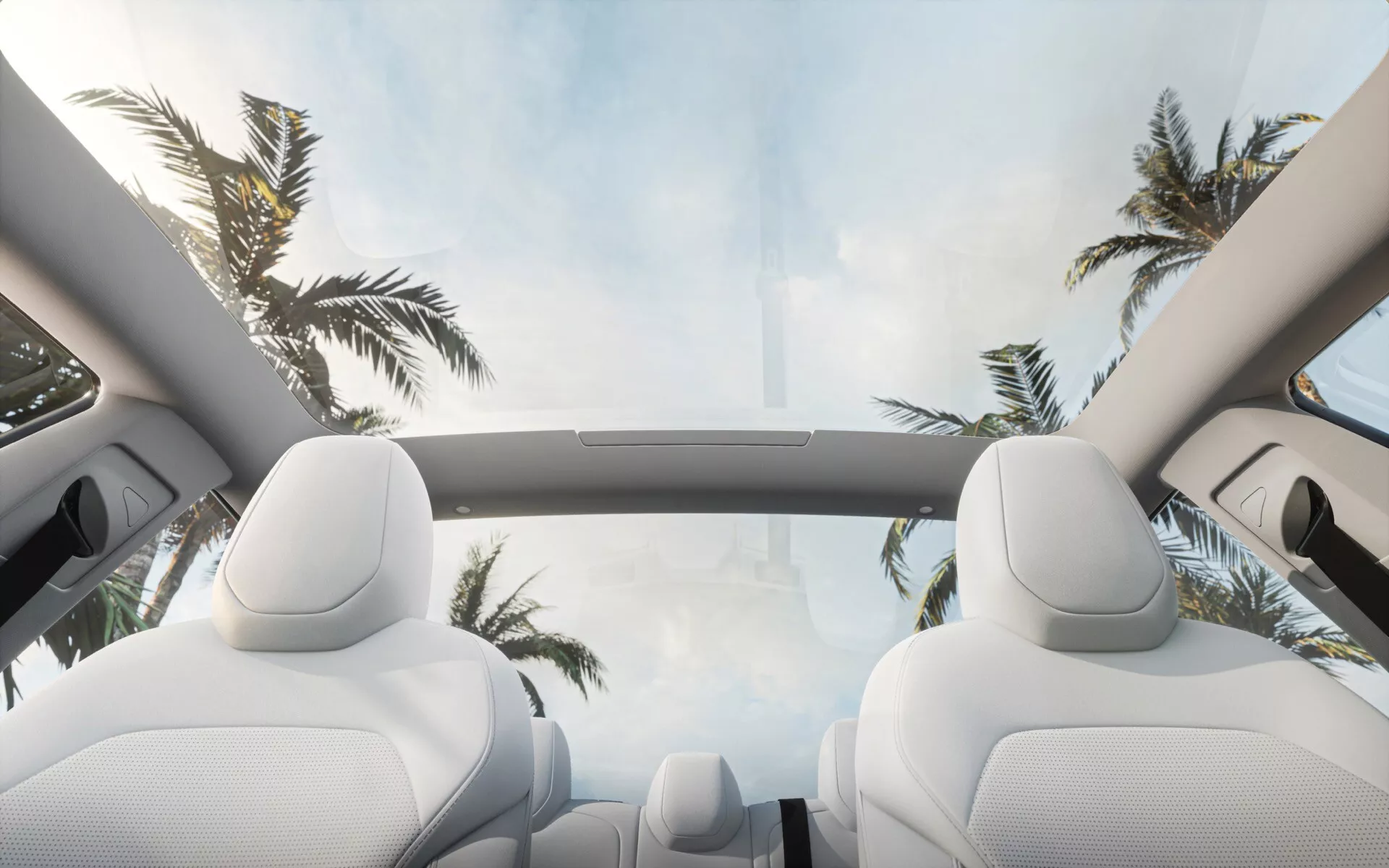 Interiörvy av Tesla Model 3 2023 (1:a generationen - Facelift) som visar det panoramiska soltaket med utsikt över himlen, vita moln och palmer, framhäver lyxiga säten och rymlig kabin design