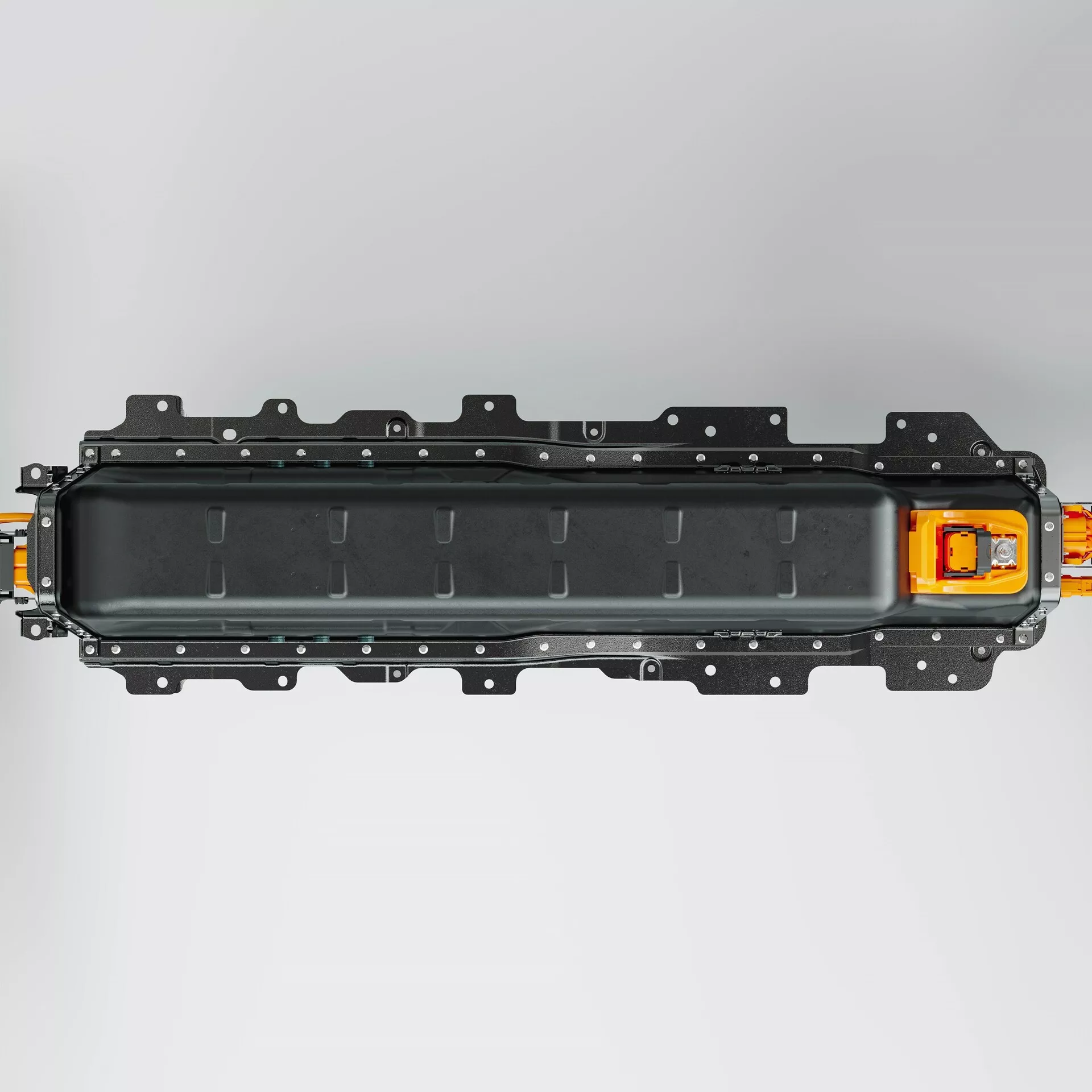 Överliggande vy av en rektangulär batterimodul som används i elfordon, med mörkt ytterhölje och flera bult hål; orange högspänningskontakt på högra sidan.