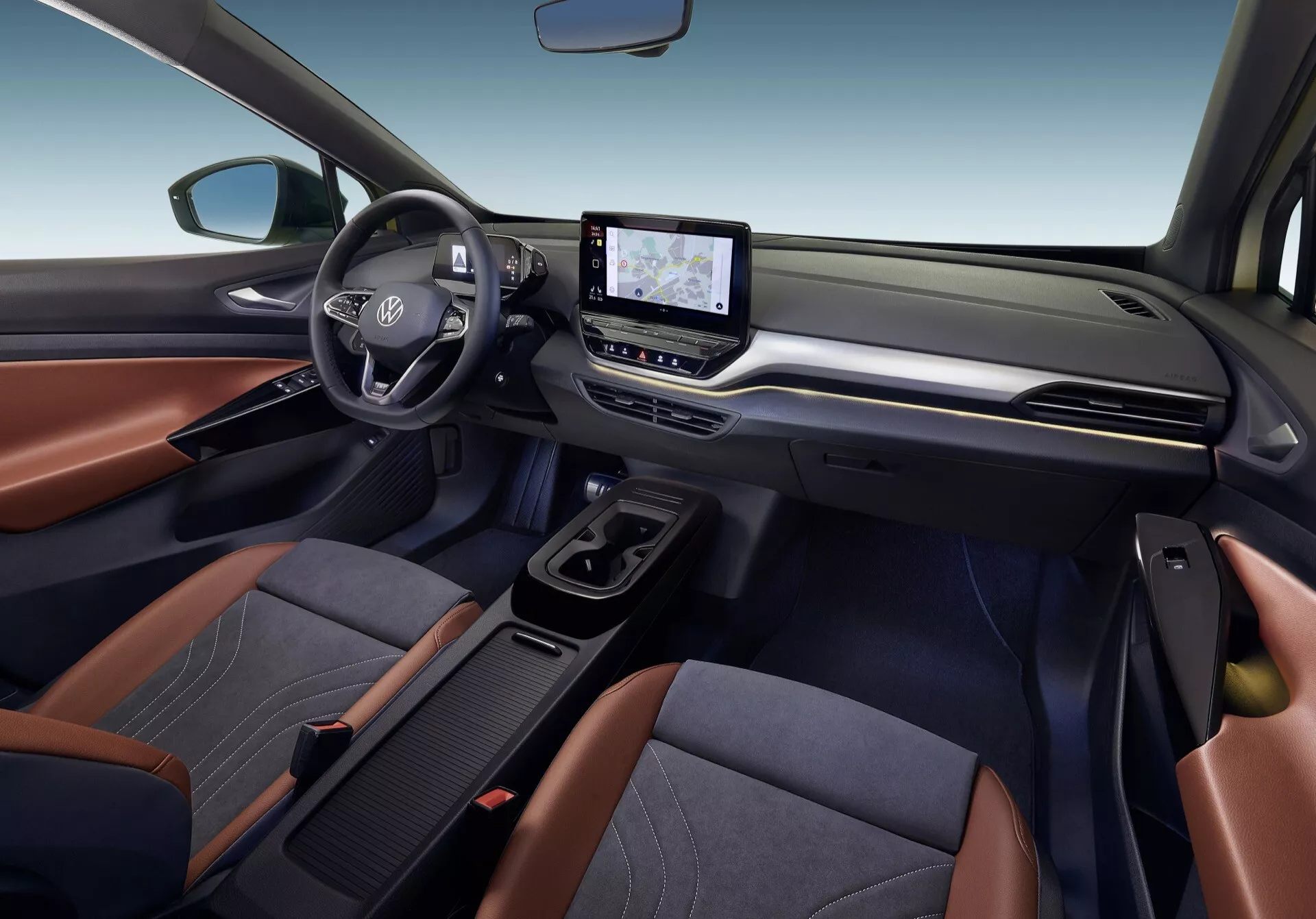 2020 VW ID.4 interiör som visar främre kabin från passagerarsidans perspektiv med vänsterplacerat rattratt, Toyota-logotyp, pekskärm för infotainment, klimatkontroll och tvåtoniga klädda säten